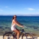 woman on bike - island life