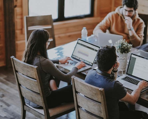 people on computers - co-working places