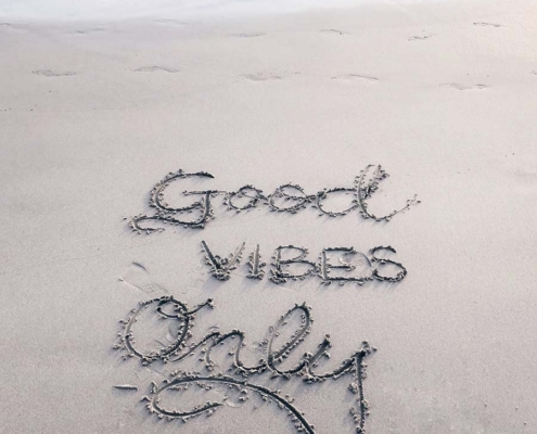 writing in the sand - urban beaches