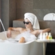 spa holidays in Austria - girl in bathtub with sunglasses- ASMALLWORLD