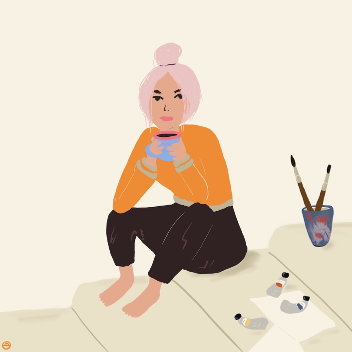 female artist drinking coffee on a break